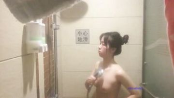 Hidden pinhole camera on the hotel bathroom mirror to spy on beautiful women taking a bath