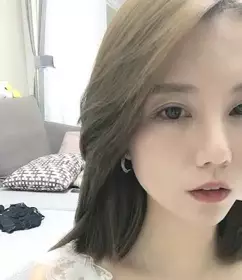 Sexy young woman doing live broadcast at home-a plum candy