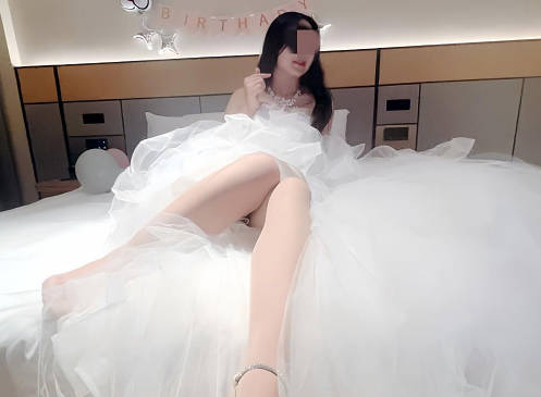On her birthday, my sister put on her wedding dress and drank in the wedding room.